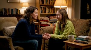 Mother supporting teenage daughter at home