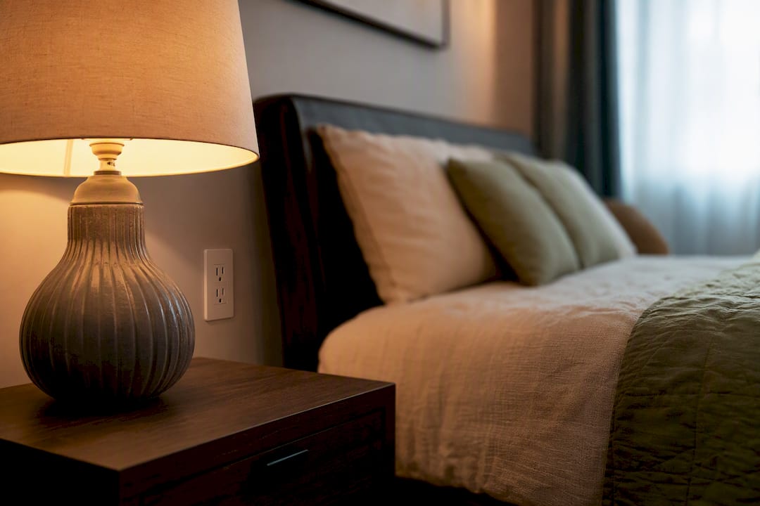 Bedside table without phone charger as habit cue