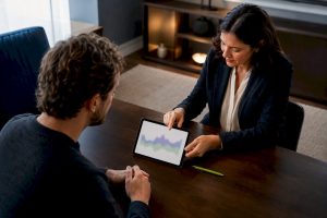 Psychiatrist reviewing mood trends with patient